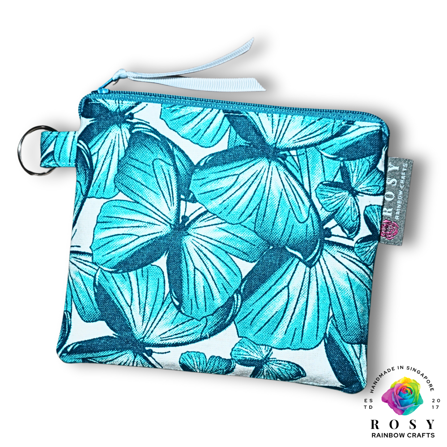 Turquoise butterfly printed pouch with a visible brand tag on a white background