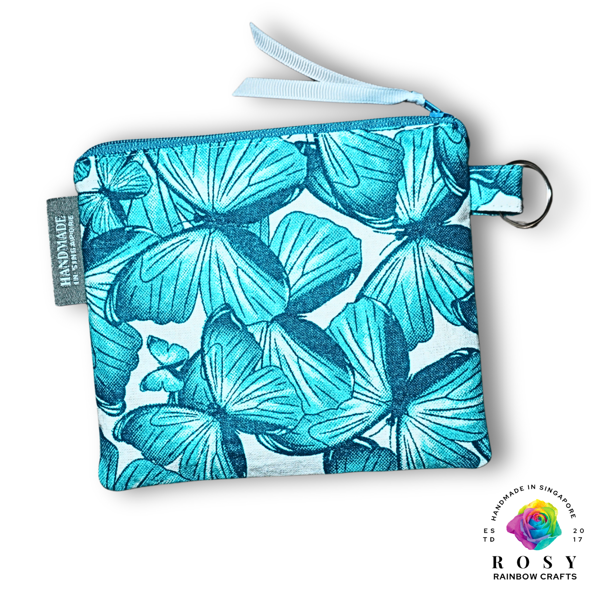 Turquoise butterfly printed pouch with a visible brand logo on a white background